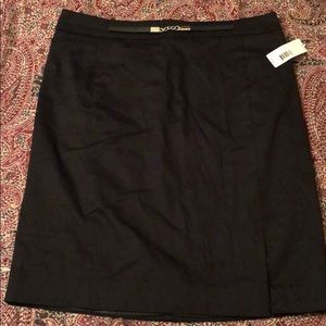 Size 6: black, to the knee,  back zip skirt.